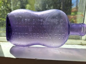 Purple (solarized) pinched flask bottle MALLARD DISTILLING CO BALTIMORE & NY