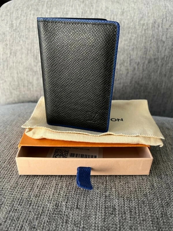 louis-vuitton pocket organizer black with blue lining. Practically unused.