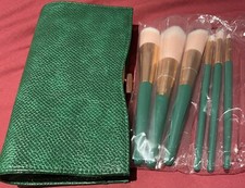 GREEN CLUTH/ MAKE UP BAG WITH BRUSHES. BRAND NEW AND SEALED.