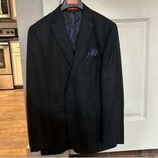 Dark plaid blazer with satin collar, paisley lining, and pocket square.