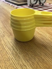 VTG Tupperware Stacking Measuring Cups Set of 4 Yellow Good Condition