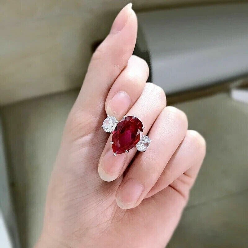 This breathtakingly unique yet elegant ruby ring features a pear shaped ruby  in a halo diamond ring style. The Mira ruby ring is surroun... | Instagram