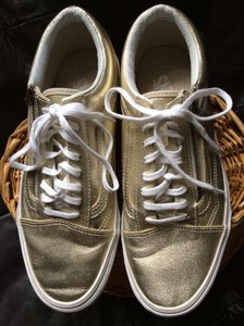 gold coloured trainers