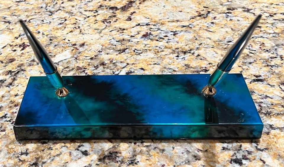 Sheaffer's wild 'tie-dye' marble-patterned metal pen desk set is a psychedelic MCM collectible you won't find at any office supply store.