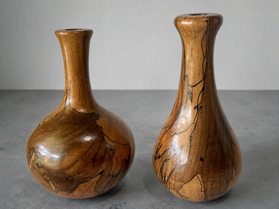 Hand-turned spalted burl wood bud vases signed by the artist in 1990 — no two alike, genuinely studio-craft beautiful, and the kind of thing galleries charge triple for.