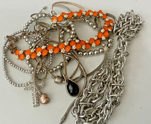 285 gram bag of vintage costume jewelry found in storage unit purchase.