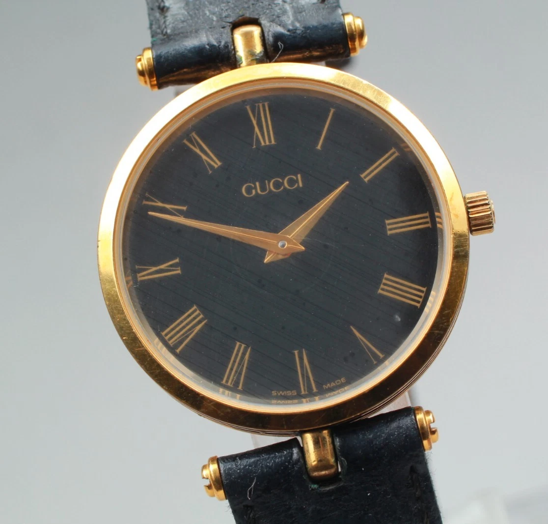 Montre homme vintage Gucci 2000M cadran noir romain quartz doré