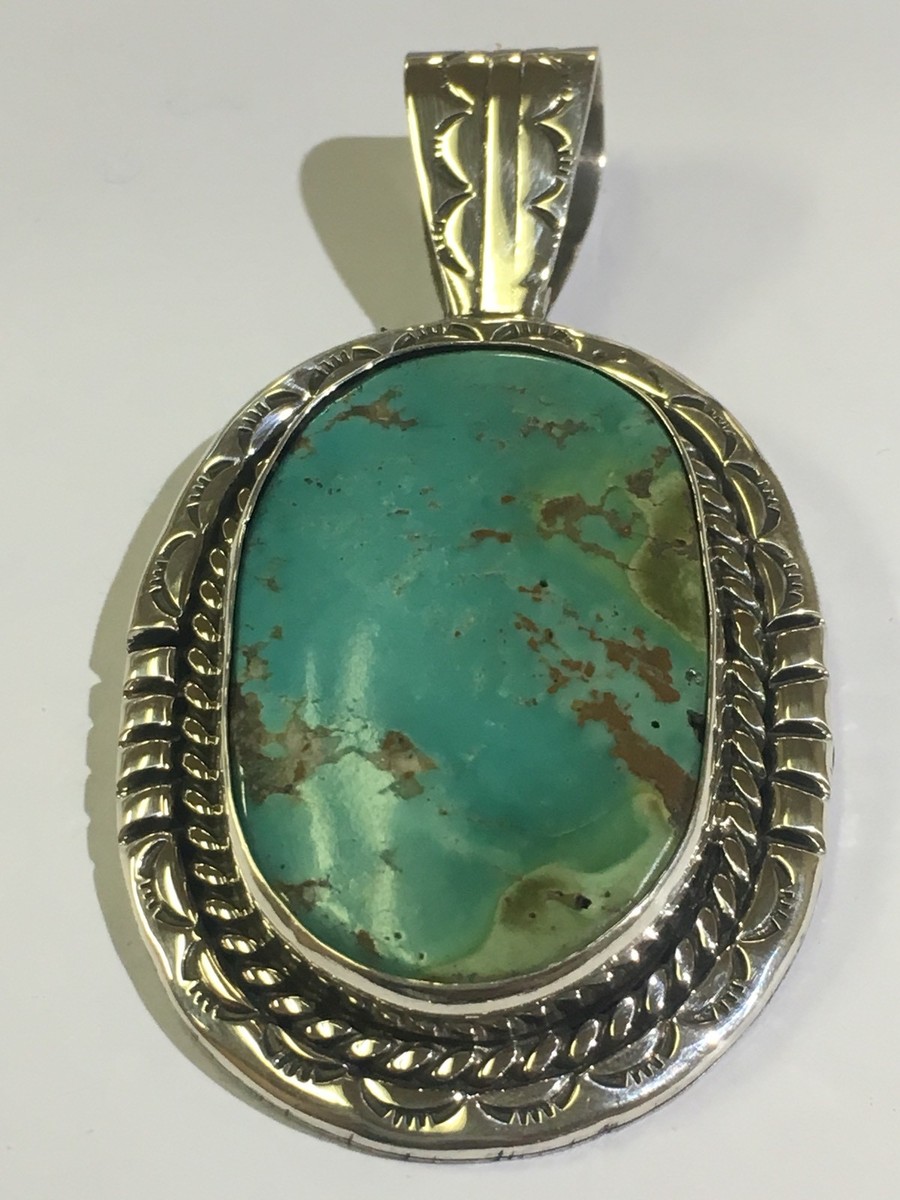 Sterling Silver Native American Turquoise Pendant. Signed Sterling Silver Native American Turquoise Pendant. Signed