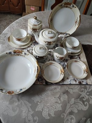 Noritake 42200 tea set with hand-painted floral motifs and gold accents.