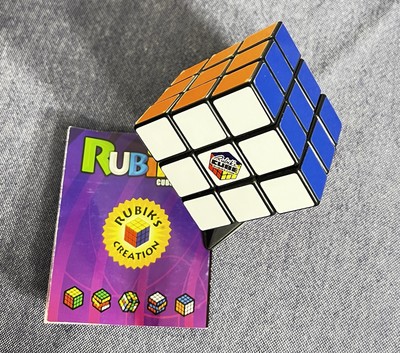 Genuine 3x3 Rubiks Cube Puzzle Brain Teaser with stand and instructions