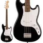Black Squier by Fender Sonic Bronco bass with white body, short scale, and three pickups, shown beside a white lapel pickup.