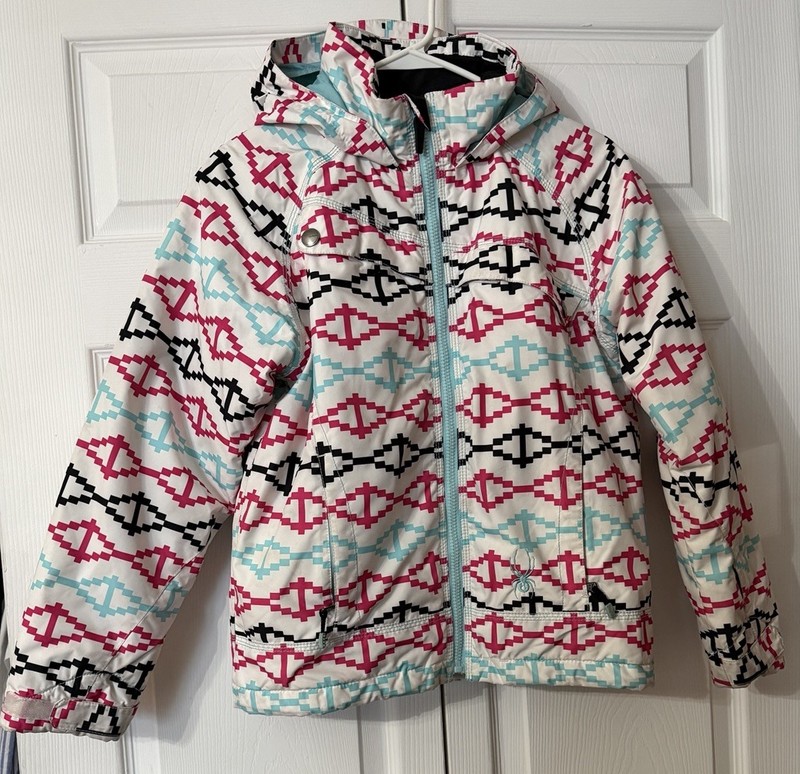 Spyder girls' insulated ski jacket with a patterned design Size 14 White