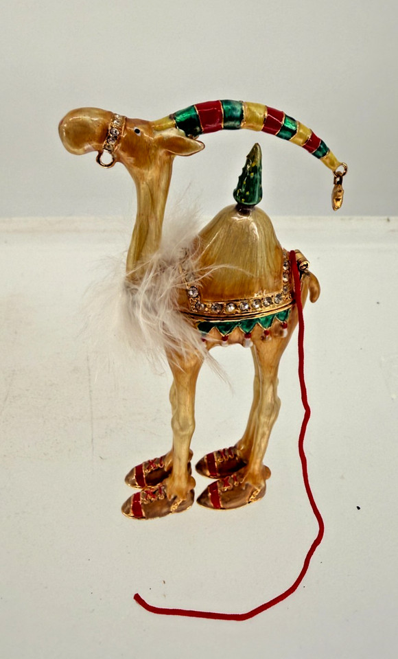 A bejeweled enamel camel trinket box that straddles the line between kitschy maximalism and genuine vintage charm — the kind of desk accent that sparks a story.