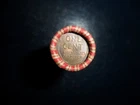 ROLL OF UNSEARCHED WHEAT PENNIES WITH A WHEAT REVERSE AND A 1937 ON THE ENDS.