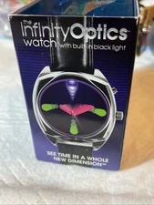 INFINITY OPTICS WATCH W/ BUILT IN BLACK LIGHT NEW IN BOX , WORKING  PLEASE READ