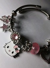 Hello Kitty Silvertone  Pink 8 Charm Stretch bracelet Girls,teens,adults,NEW