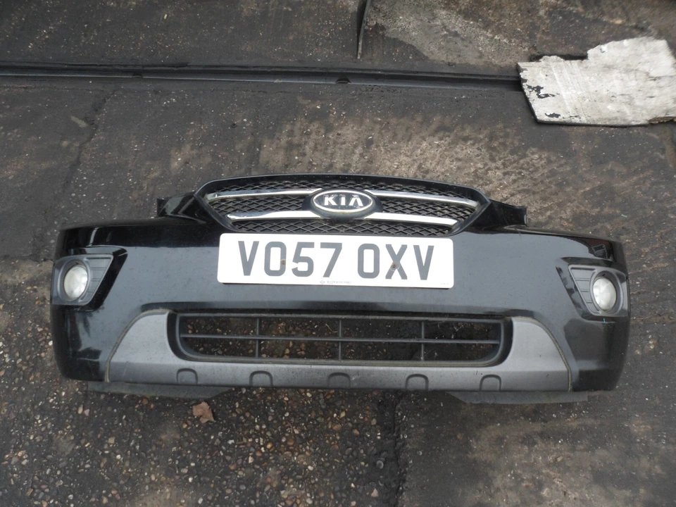KIA CARENS 2007 COMPLETE FRONT PLASTIC BUMPER IN BLACK FOG LIGHT GRILL GRILLE
