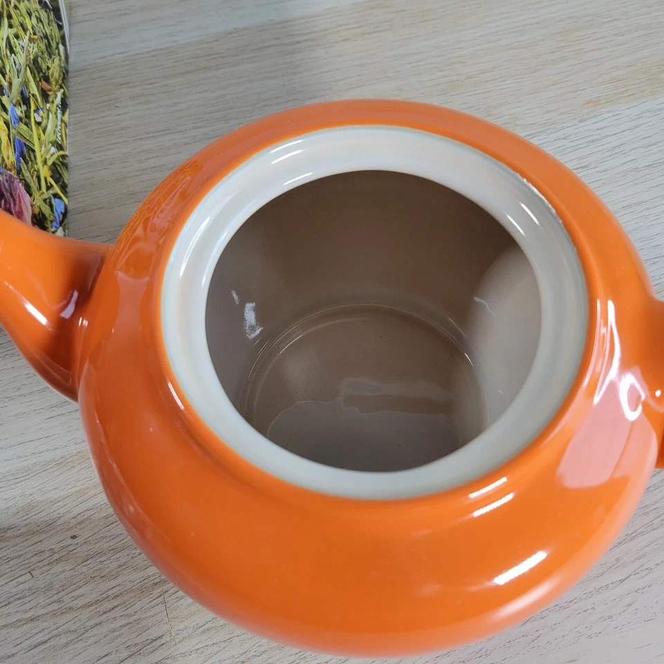 Tetera pequeña de gres Le Creuset con infusor rojo volcánico naranja nueva caja abierta Foto 4 de 4