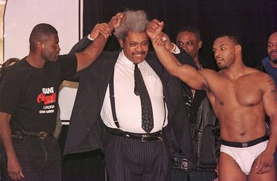 MIKE TYSON GLARES AT BUSTER MATHIS WITH PROMOTER DON KING STANDING- Old Photo