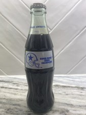 This item is a 1993 Dallas Cowboys Super Bowl XXVIII Champions Coca-Cola bottle,