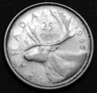 1965 25¢ silver coin in a paper flip