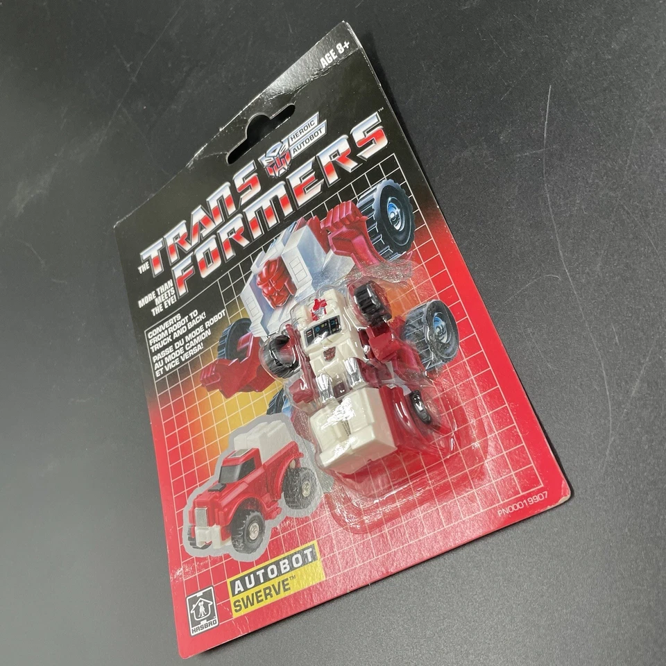 Hasbro - Transformers: G1 Reissue (2018) Swerve; NEW Mint on Sealed Card - Image 4 of 4