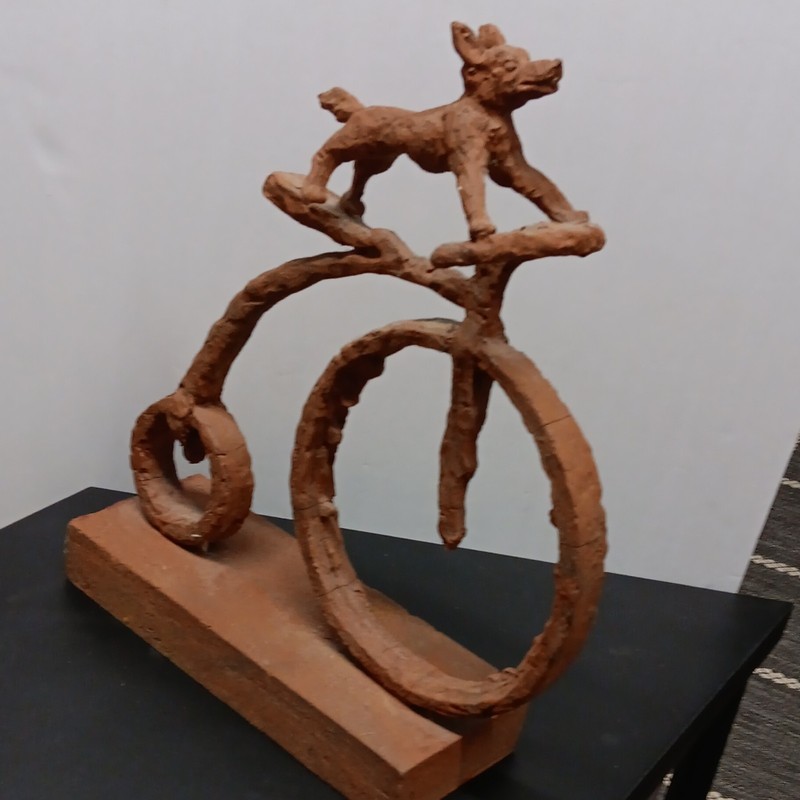 Terracotta Dog on Bicycle Sculpture Brown Handmade Animal Decor