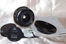 EXC objectif PK 28mm f2,8 SMC PENTAX A avec bouchons, pare-soleil et housse TBE