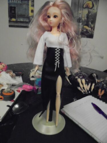 GENERIC BARBIE DOLL IS DRESSED IN BLACK dress shoes and a stand included  - Picture 1 of 5