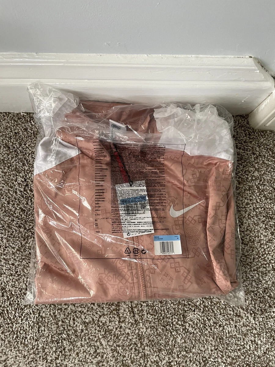 Nike rose gold tracksuit sale