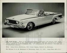 1961 Press Photo Lady smiles from a 1962 model Dodge Polara "500" convertible