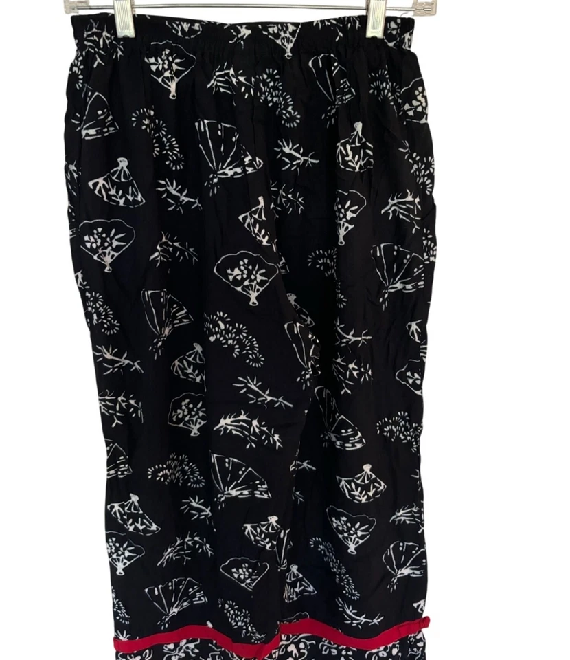 Pantalones de rayón Nomadic Traders para mujer negros blancos con estampado floral talla pequeña Foto 2 de 4
