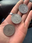 3 -silver peace dollars- 2- 1925, 1- 1922, circulated- 90%