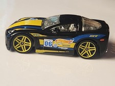 2004 Hot Wheels 2005 CHEVY CORVETTE TM GM - black w/ yellow blue stripes