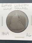 1869 Seated Liberty Half Dollar. AG