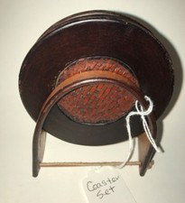 Hand tooled leather coaster set with stand. Basket weave.