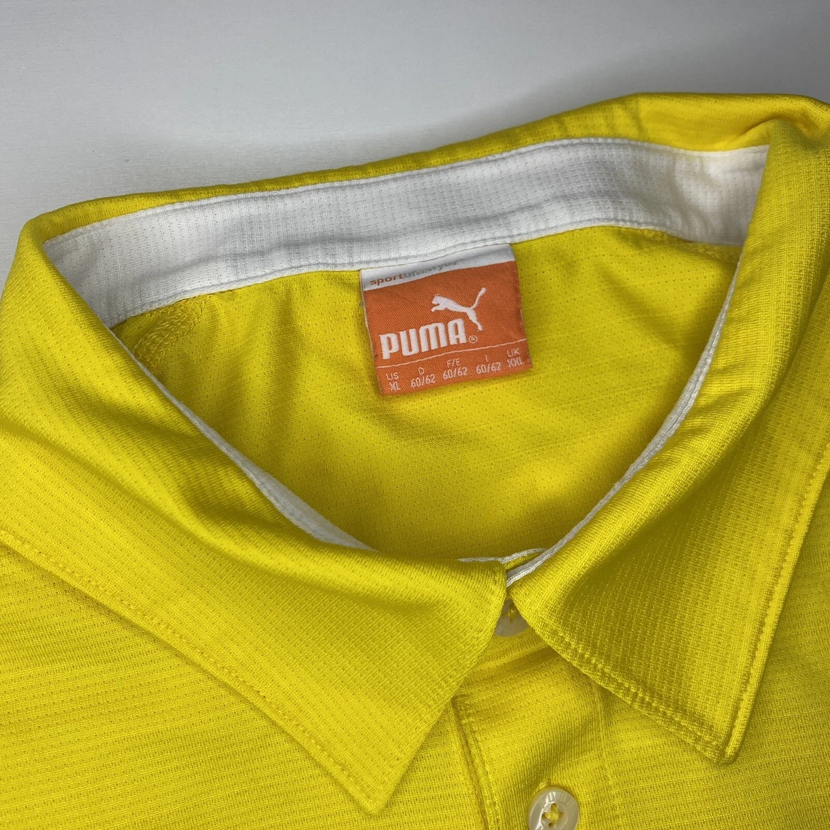 Yellow puma golf best sale shirt