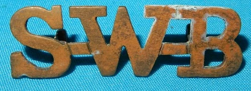 WW1 ERA SWB SOUTH WALES BORDERERS REGIMENT SHOULDER TITLE BADGE GENUINE