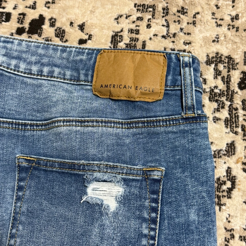 Pantalones de mezclilla para hombre American Eagle 36x30 ajustados flexibles desgastados lavado medio azul Foto 3 de 4