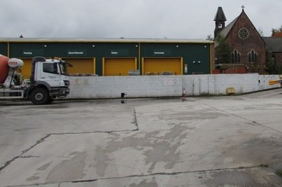 Foto 6x4 Travis Perkins Hof, Wigan von der Queen Street aus gesehen. c2017