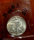 1946-D SILVE WALKING LIBERTY HALF DOLLAR - GRADES "ABOUT UNCIRCULATED"