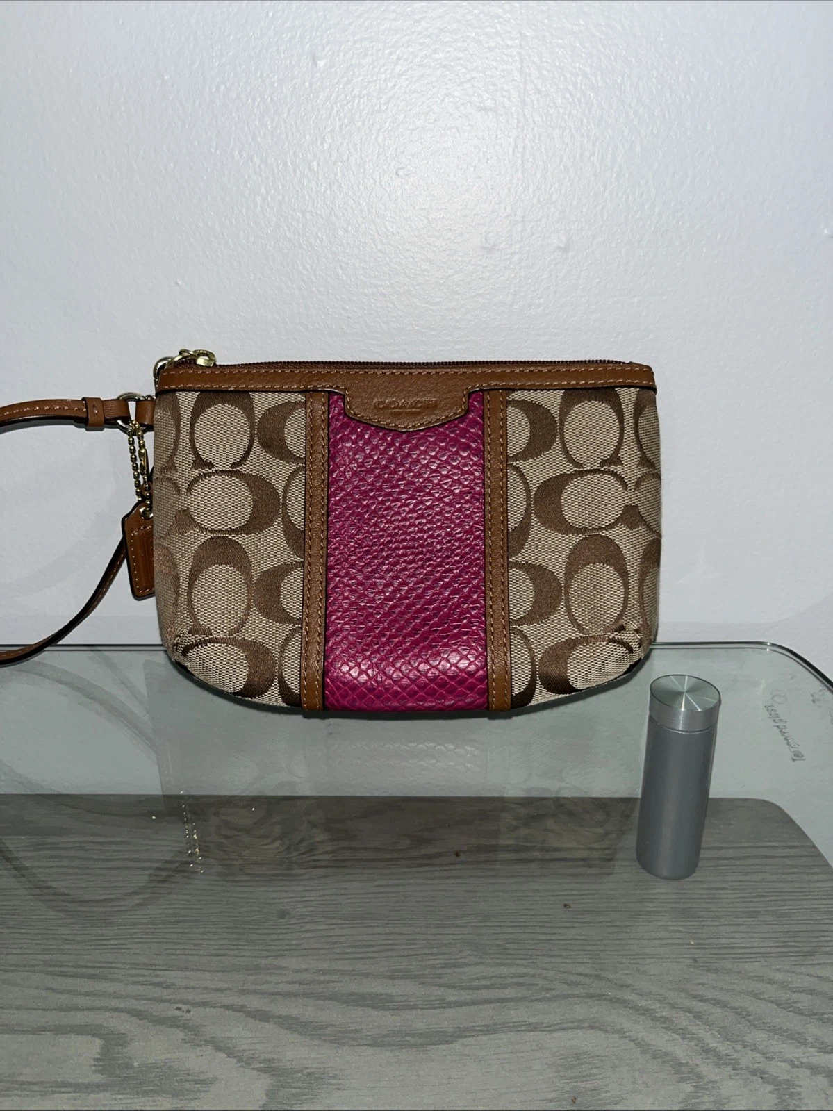 Bracciale COACH con zip angolare in tela firmato a righe kaki e viola