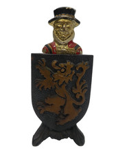 VINTAGE BEEFEATER BRITISH GUARD CAST METAL BOTTLE OPENER WITH STAND