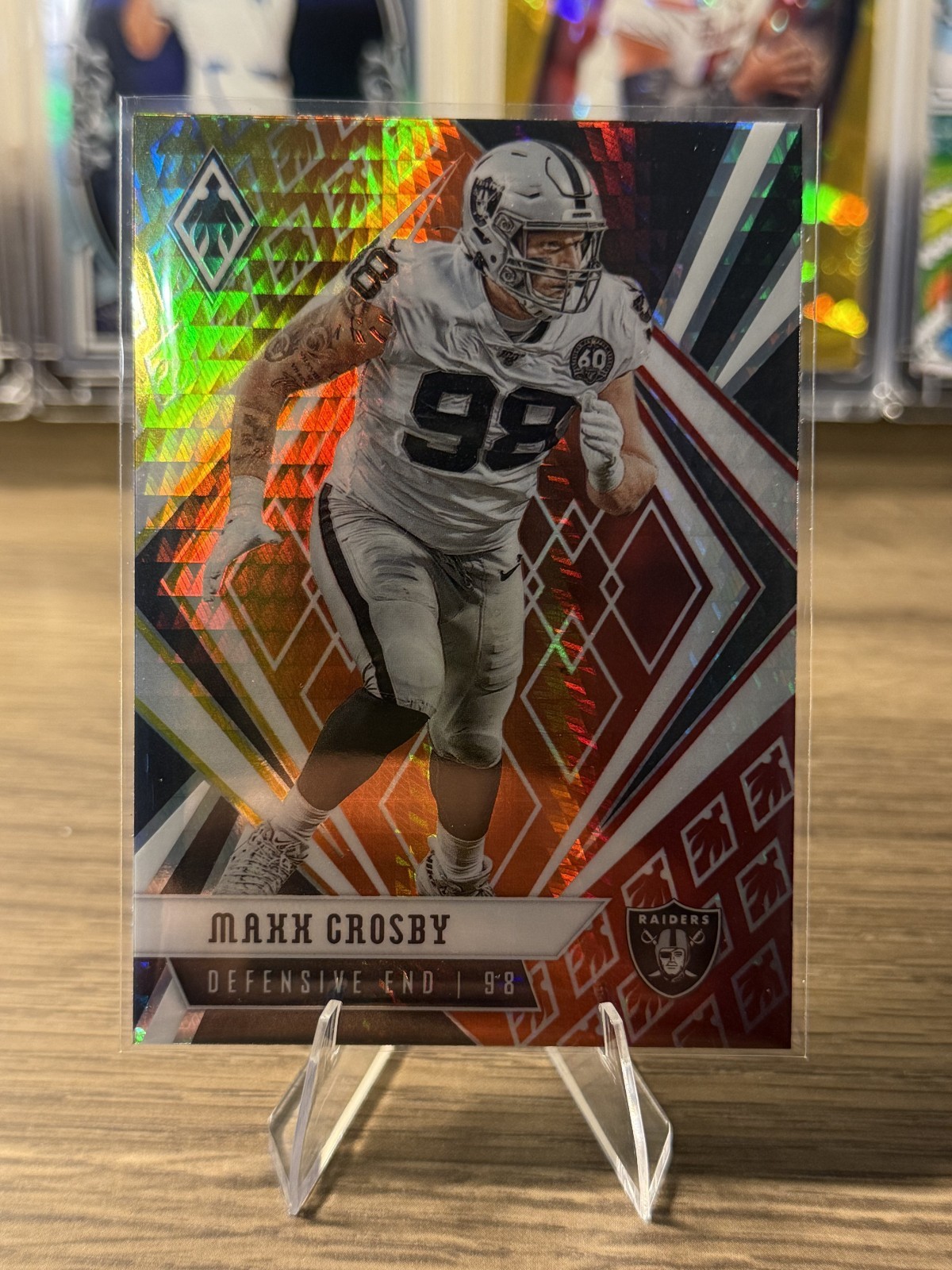 2020 Panini Phoenix Maxx Crosby Fire Burst Parallel #77 Las Vegas Raiders