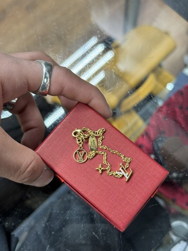 LOUIS VUITTON Rhinestone/Metal Gold Played L.V Initial & Star Bracelet M00587 - Picture 3 of 11