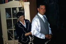 35mm Slide 1940s Red Border Kodachrome Mother Helping Man Get Dressed Wedding