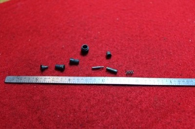 Colt Cobra,38 spl,  used parts, 3 screws,1 nut,1 pin,2 plungers,1 spri, 92725-os