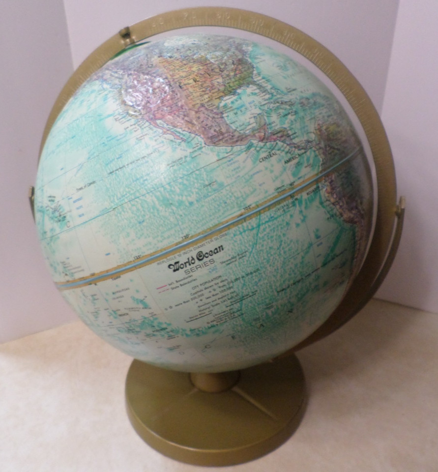 A vintage Replogle Ocean Series globe — one of the most respected American globe makers — with that gorgeous antique cartographic aesthetic on a metal base.