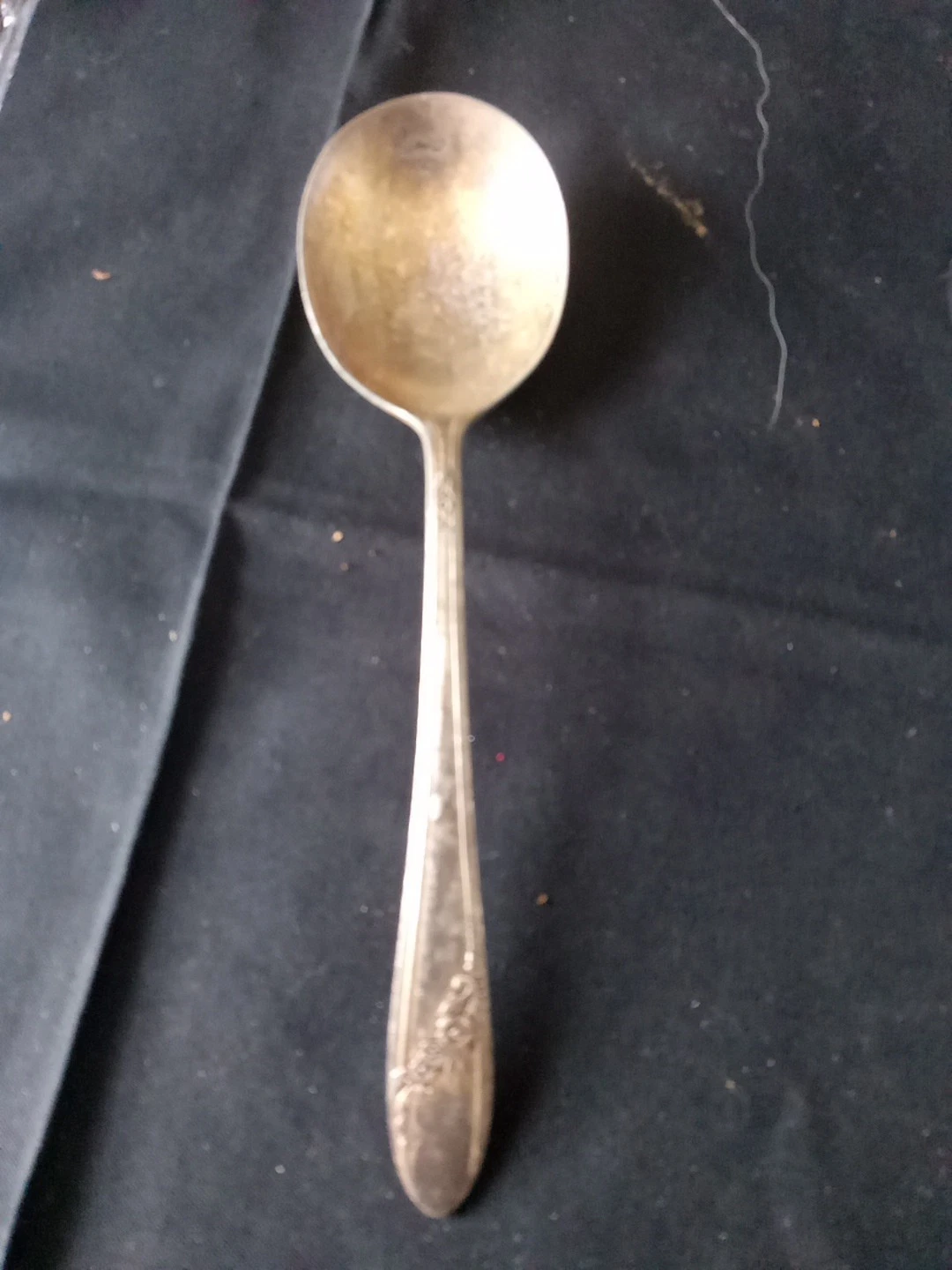 silver-plated spoon or ladle from Oneida Community's Tudor Plate line.