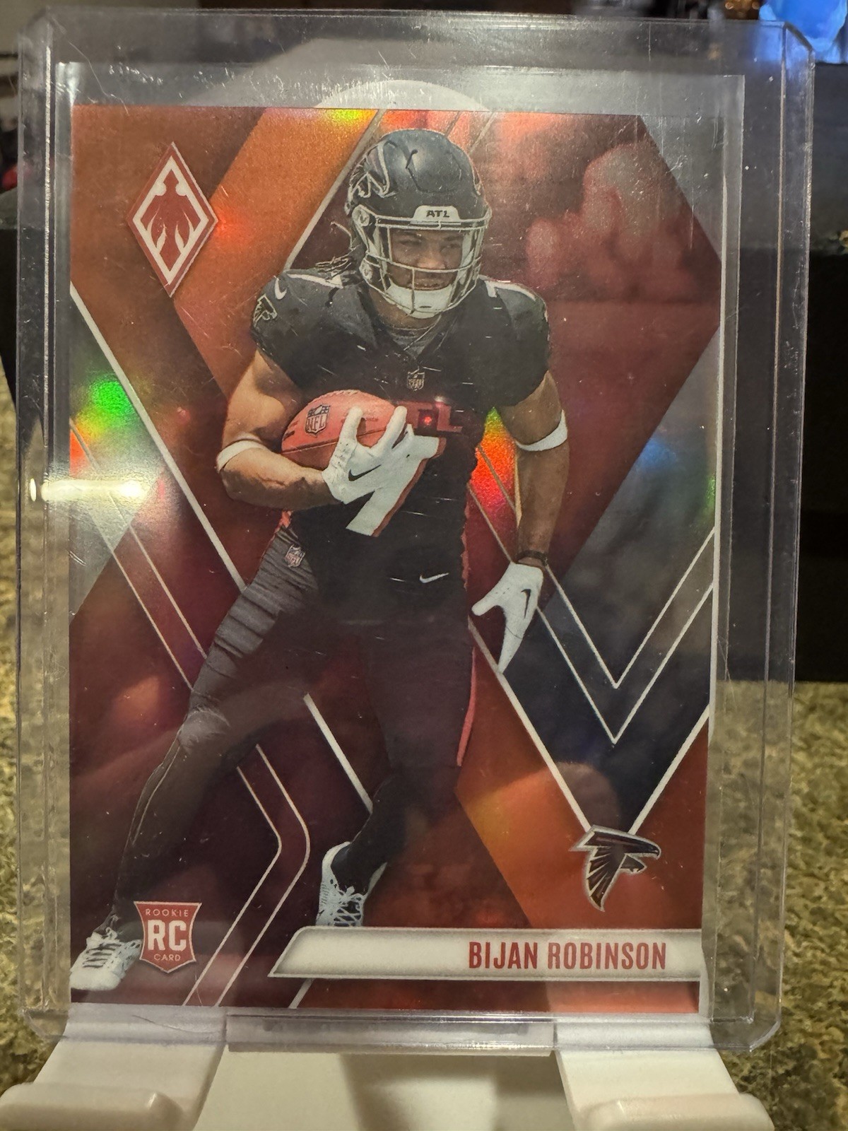 2023 Panini Phoenix - Rookies Bijan Robinson #104 Orange /99 (RC) Falcons